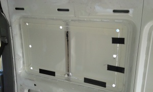 Just about finished cutting the hole for the 2nd 900x500 window.  Black tape is to reduce the vibration as we cut.